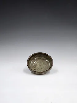 Shallow speckled bowl.